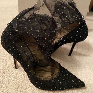 Jimmy Choo pumps “lavish”